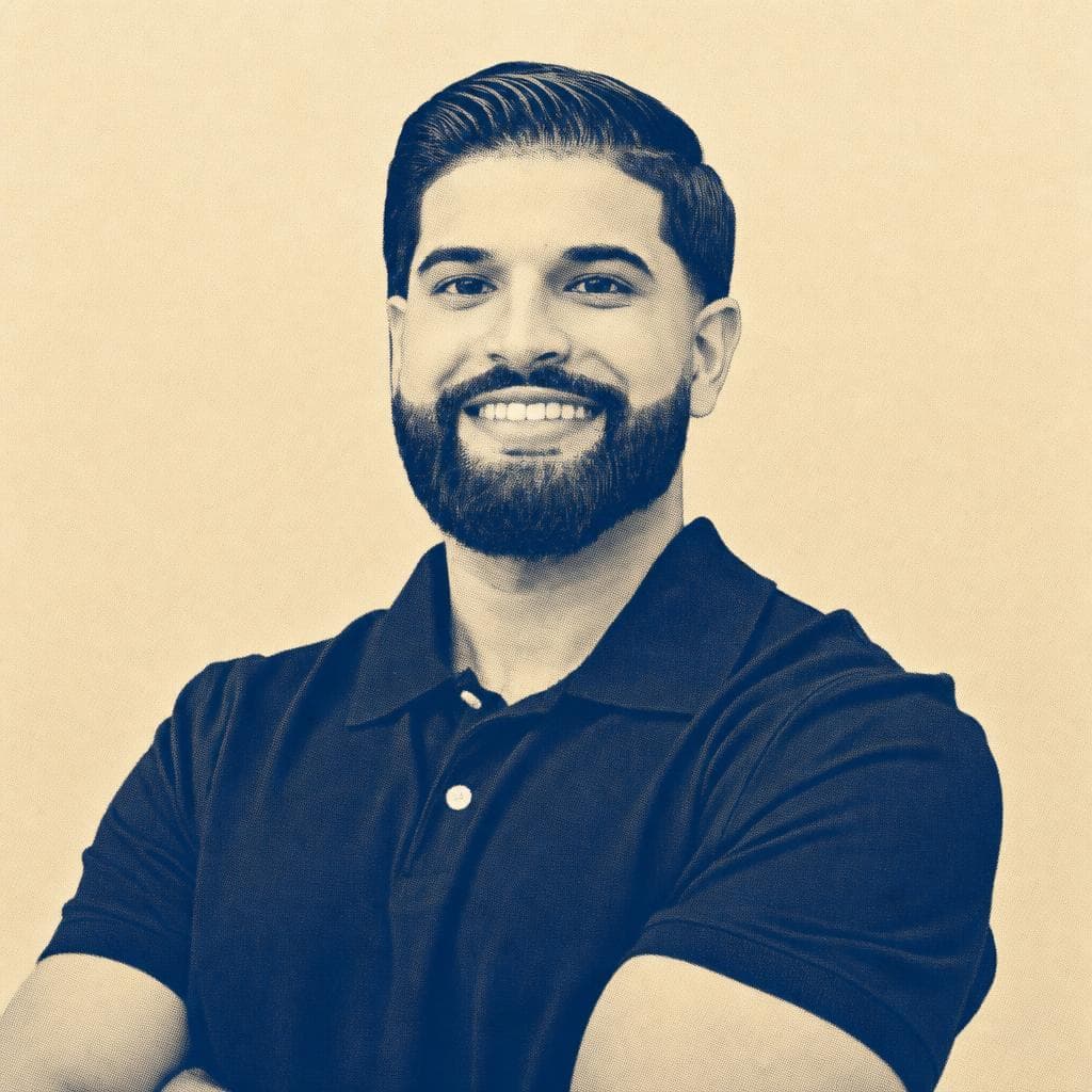 Harpreet Dhaliwal, in a black polo, photographed against a wood wall.