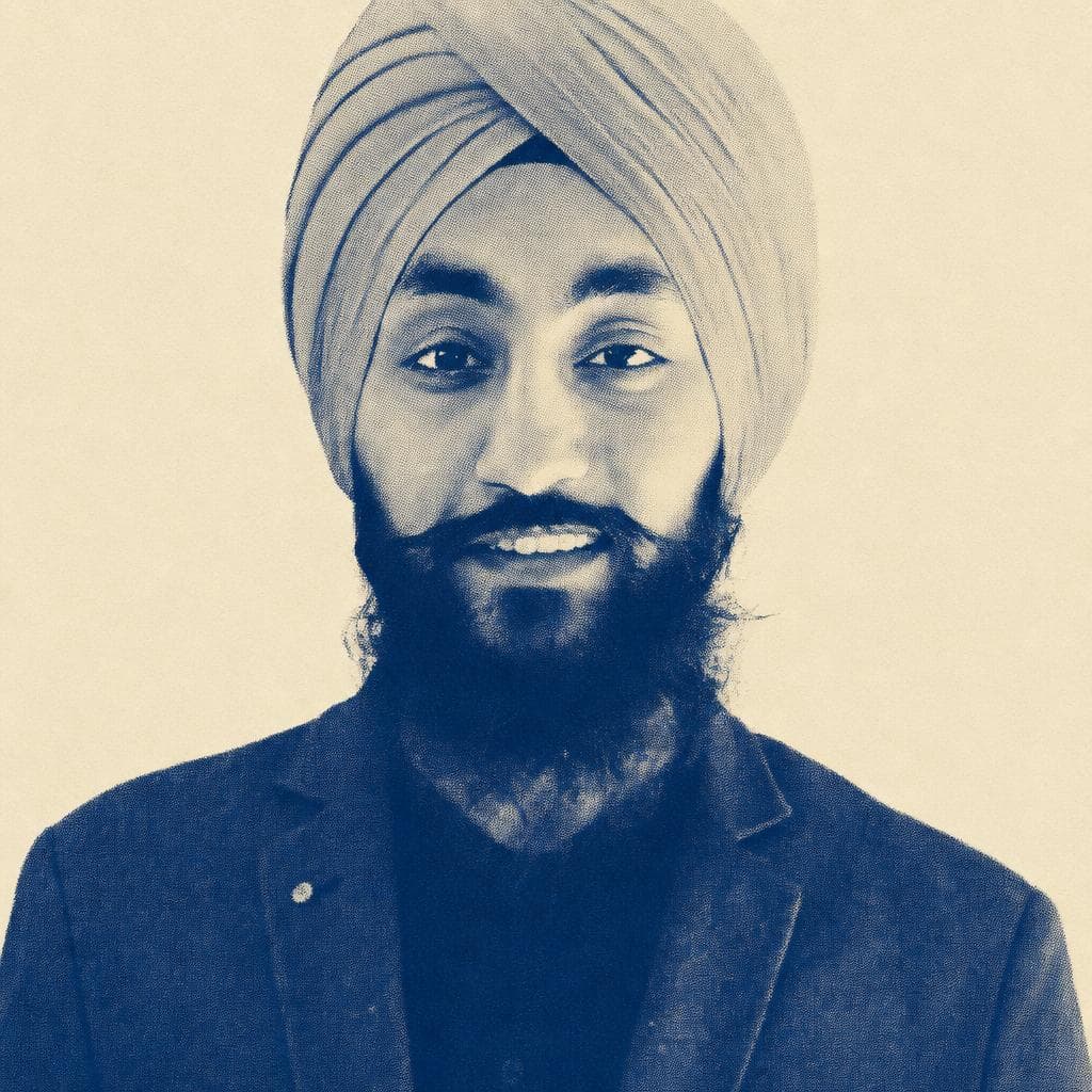 Inderpreet Singh, in a peach dastar and dark blazer.