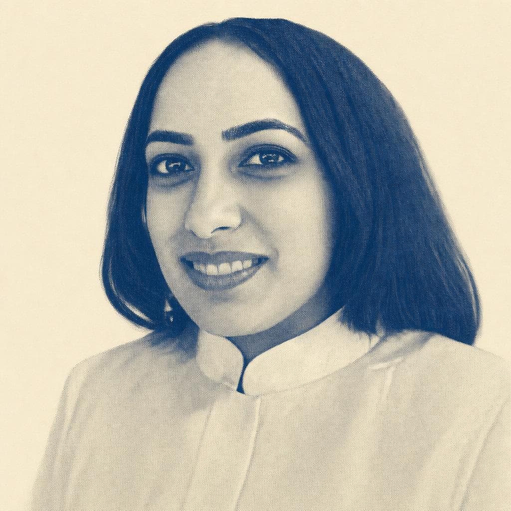 Jassimran Kaur Chadha, in a teal top and pearls.