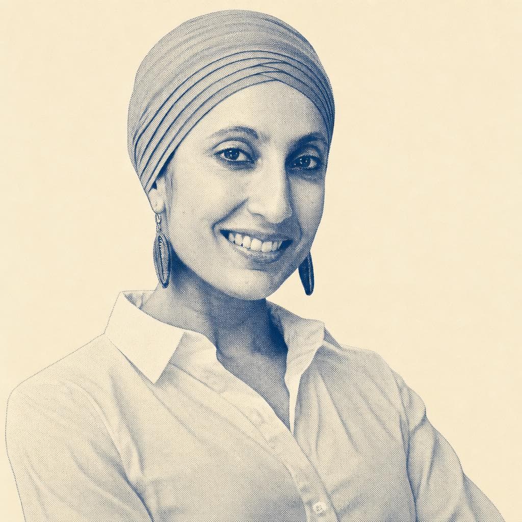 Manmeet Kaur, in a pink head covering and white shirt, photographed outdoors.