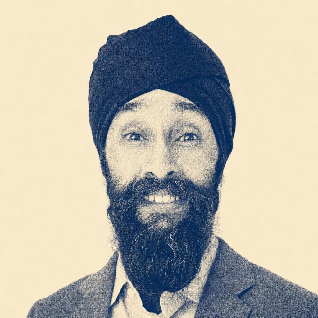 Prabhjot Singh, in a navy dastar, grey blazer and light blue shirt.