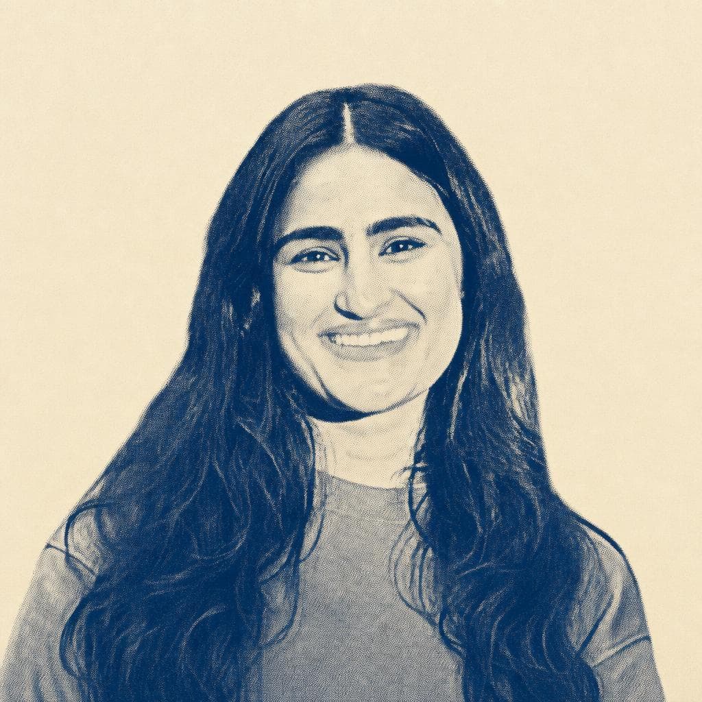 Sukhmani Kaur Lamba, with long dark hair, photographed smiling.